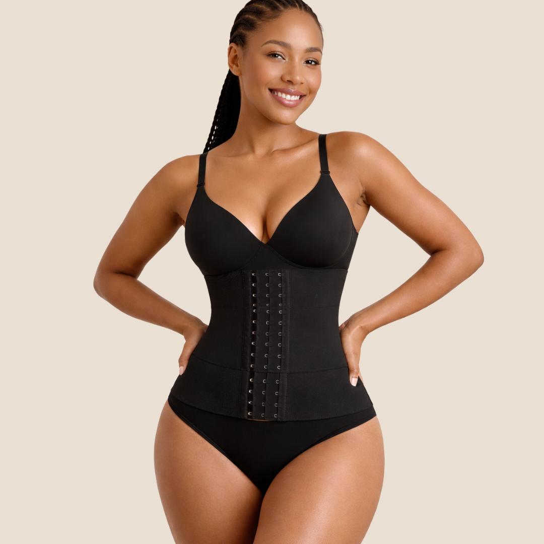 Woman wearing a black waist trainer against a beige background