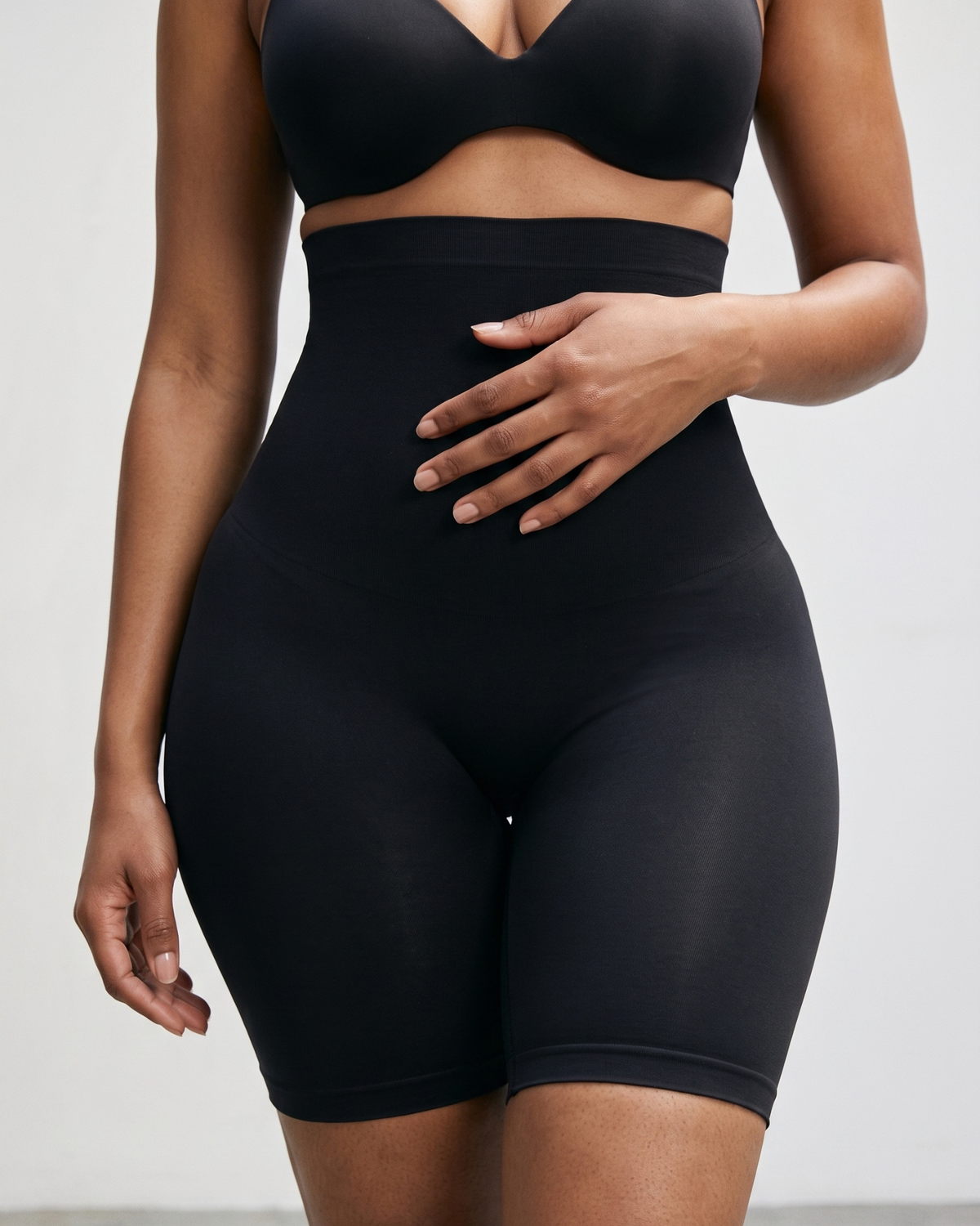 Women wearing black shapewear shorts